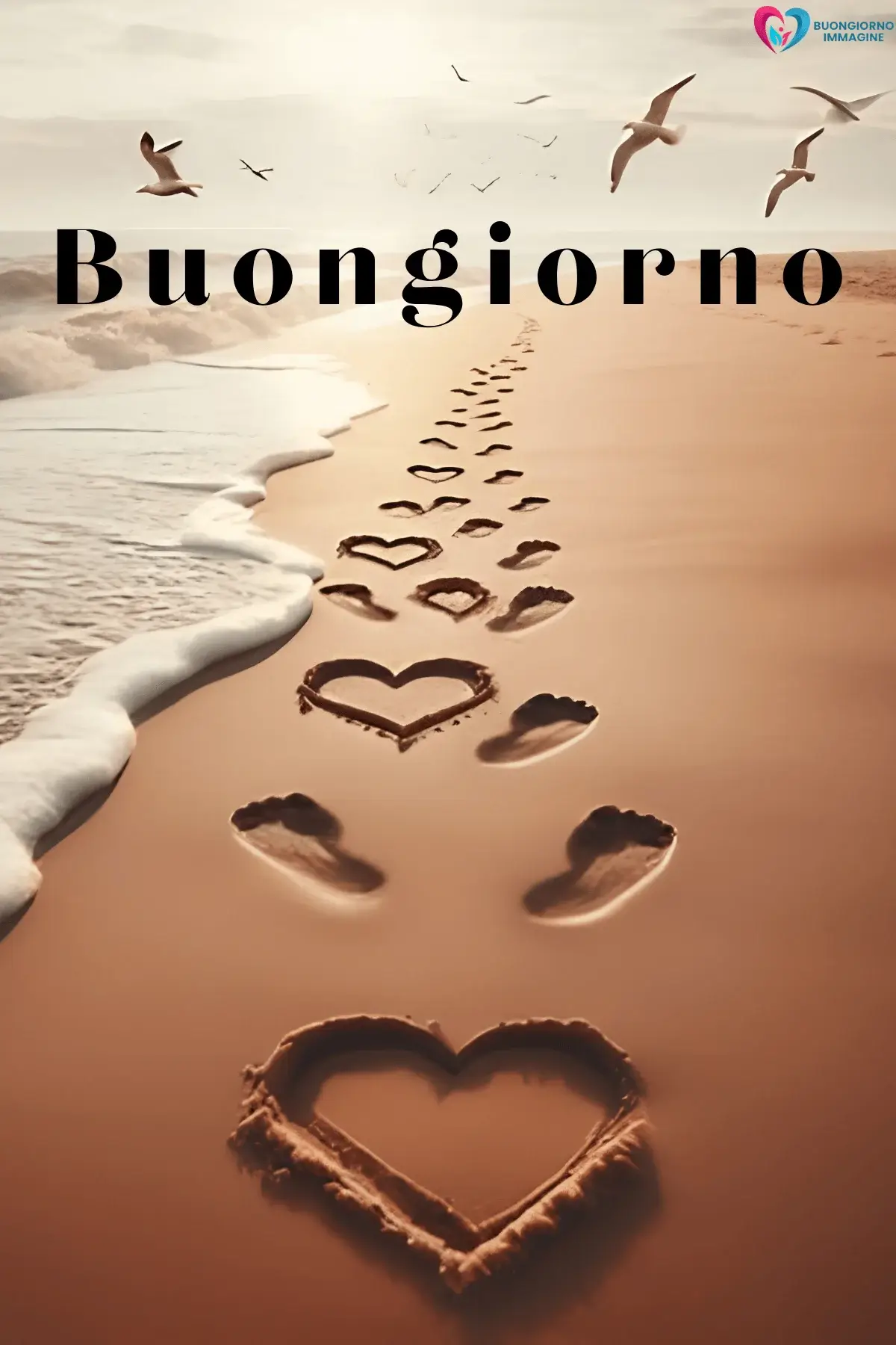 Impronte e cuori disegnati sulla sabbia con gabbiani in volo, buongiorno cuore immagini gratis per WhatsApp