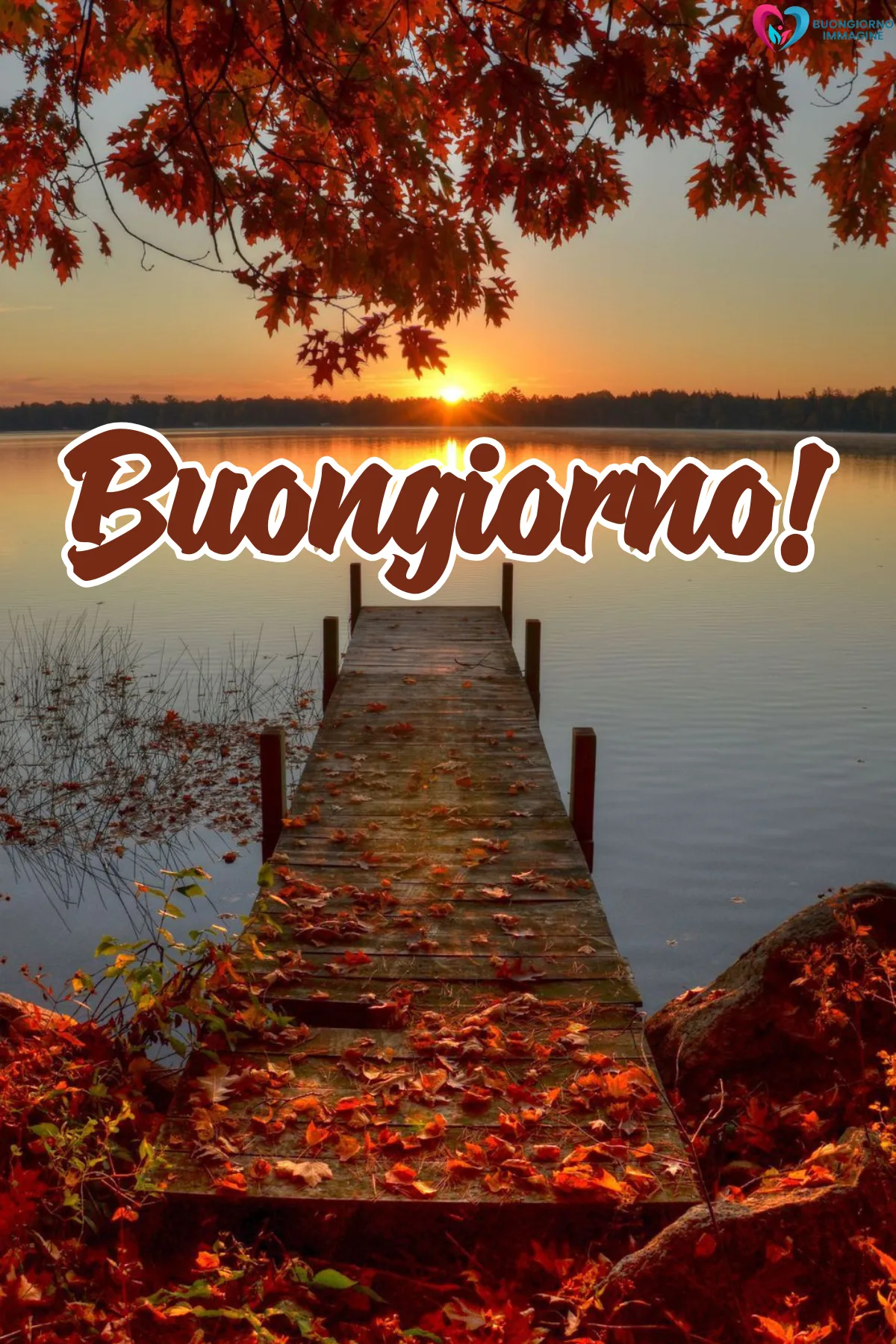 buongiorno 1 settembre - pontile autunnale al tramonto con foglie rosse sul lago - immagini nuove gratis per WhatsApp